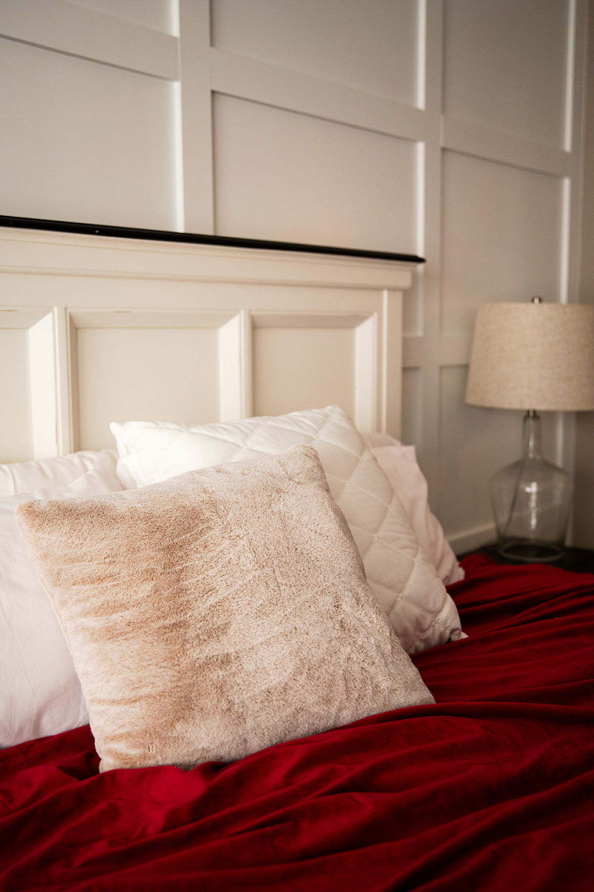 chattanooga boudoir studio with blue sofa, red king size bed, wood floors for an empowering photoshoot